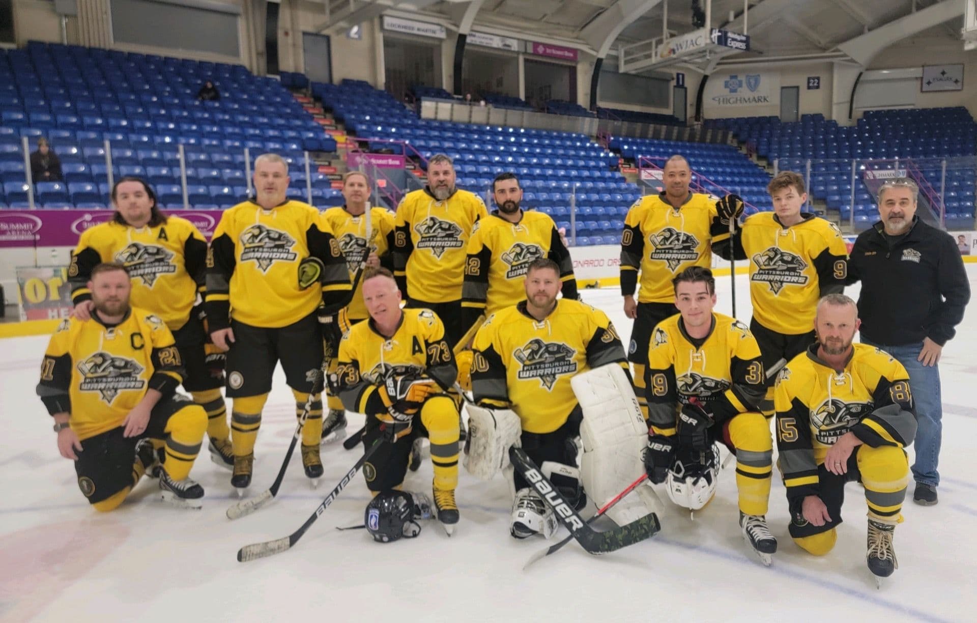Pittsburgh Warriors team gathered on the ice before competition.